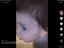 a baby 's face is shown on a phone screen with a caption that says " side eye "