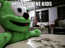 a gummy bear stuffed animal sitting on a table with the caption howard the kids