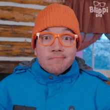 a man wearing glasses and an orange beanie says i don 't need anything back