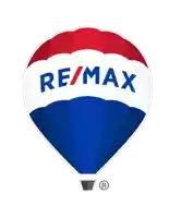 a red white and blue hot air balloon with re / max written on it