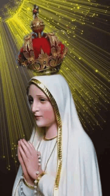 the virgin mary is wearing a crown on her head and praying .