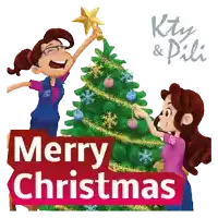 two girls decorating a christmas tree with the words merry christmas behind them