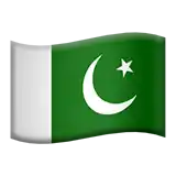 a green and white flag with a crescent moon and star on it is waving in the wind .