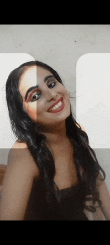 a woman with makeup on her face is smiling and taking a selfie