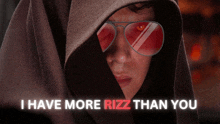 a man wearing a hooded jacket and red sunglasses says i have more rizz than you