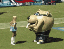 a cheerleader stands next to a mascot on a field with a scoreboard behind them that says 1st & 10