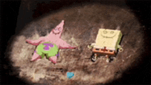 patrick star and spongebob squarepants are sitting in the sand .