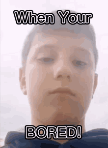 a young man 's face is shown with a caption that says when your bored