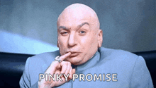 a bald man is holding his finger to his mouth and the words pinky promise are below him