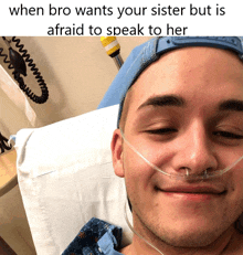 a young man in a hospital bed with an oxygen mask on his nose