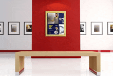 a wooden bench in front of a red wall with a poster hanging on it