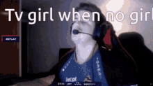 a man wearing headphones and a microphone with the words tv girl when no girl below him