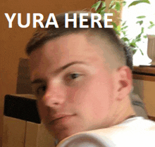 a close up of a man 's face with the words " yura here " above it