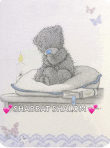 a shabbat shalom card with a teddy bear sitting on a table