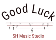 a logo for good luck music studio with music notes