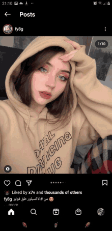 a girl wearing a tan hoodie that says fail dancing on it