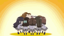 a group of girls are standing around a girl laying down