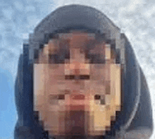 a pixelated image of a person wearing a hooded jacket .