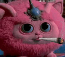 a pink stuffed animal is smoking a cigarette .