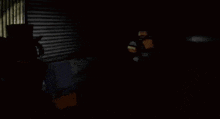 a blurry picture of a man holding a gun in the dark