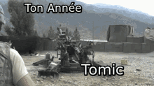 a soldier stands in front of a cannon that says ton année