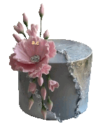 a gray cake with pink flowers and the letters ac on the top