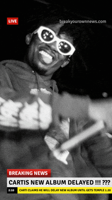 a black and white photo of a man wearing sunglasses with the words breaking news