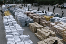 a large warehouse filled with lots of boxes of cocaine .