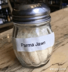 a jar of parma jawn sits on a counter