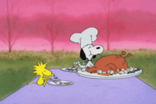 snoopy and woodstock are sitting at a table with a turkey on a plate .