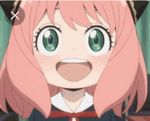 a girl with pink hair and green eyes is smiling with an x next to her