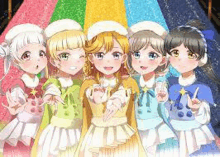 a group of anime girls are standing next to each other in front of a rainbow colored background .