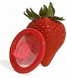 a strawberry and a condom are cut in half .