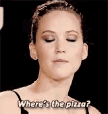 a woman with her eyes closed is asking where 's the pizza ?