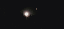 a full moon is visible in the night sky