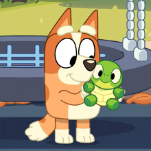 a cartoon dog holding a green stuffed animal