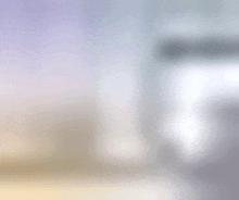 a blurred image of a room with a purple and white gradient .