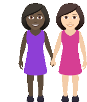 a couple of women standing next to each other and holding hands