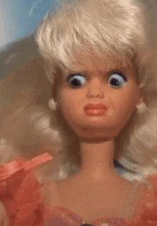 a close up of a barbie doll with big eyes