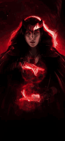 scarlet witch from marvel comics is holding a red glowing object in her hands .