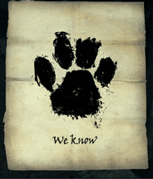 a piece of paper with a black paw print and the words we know on it