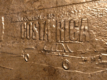 the word costa rica is engraved on a wall