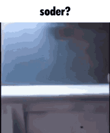 a blurred image of a window with the words soder written above it .