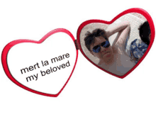 a heart shaped mirror says mert la mare my beloved on it