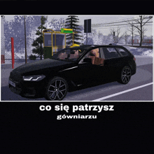 a black car is parked on the side of the road in front of a bus stop with the words co sie patrysz gowniaru