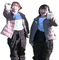 two girls are holding up glasses of milk and one has a shirt that says milk on it