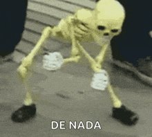 a skeleton is standing in front of a sign that says ' de nada ' on it