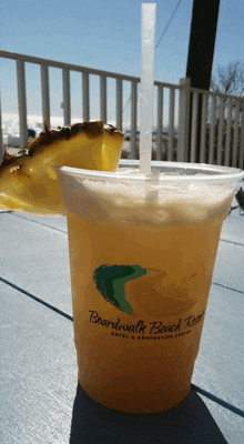 a drink with a pineapple slice in it is from boardwalk beach resort