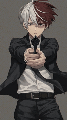 a man in a suit is pointing a gun at something