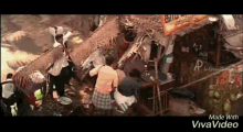 a group of people are gathered under a thatched roof in front of a sign that says ' a ' on it